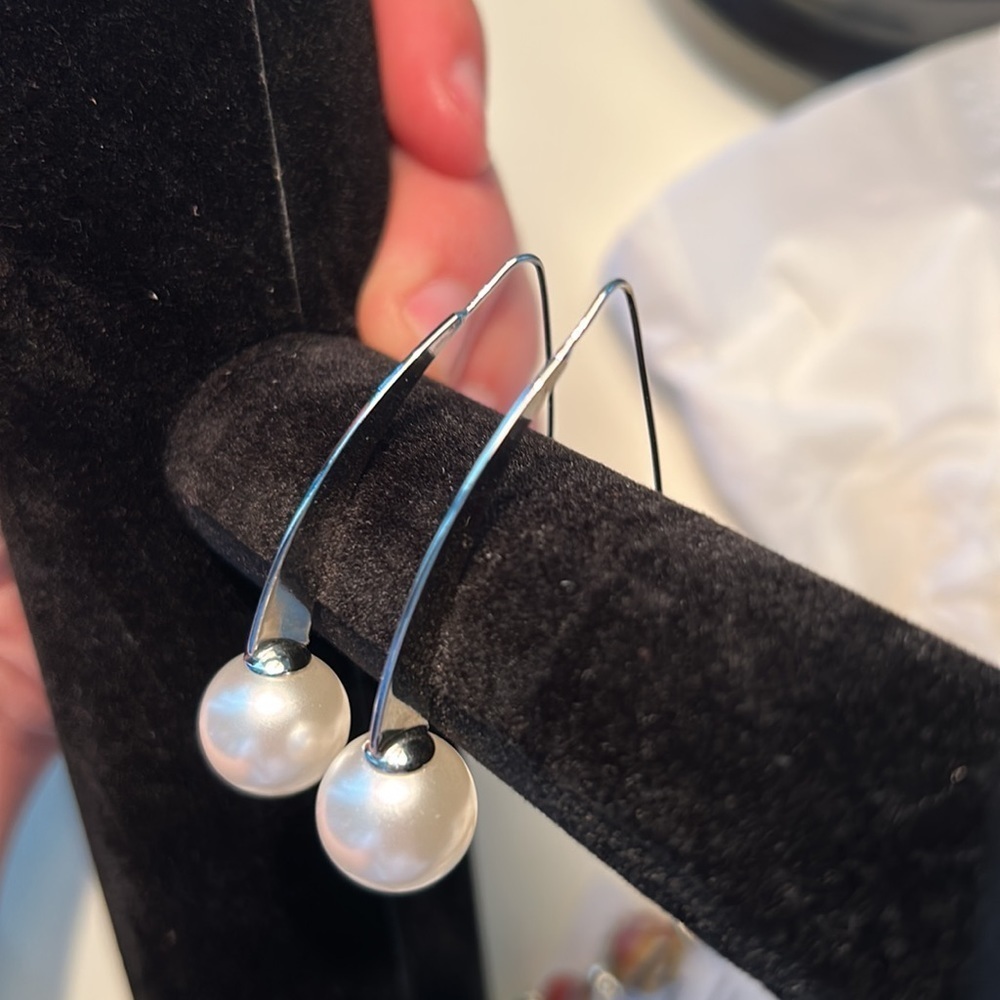 Pearl long earrings.